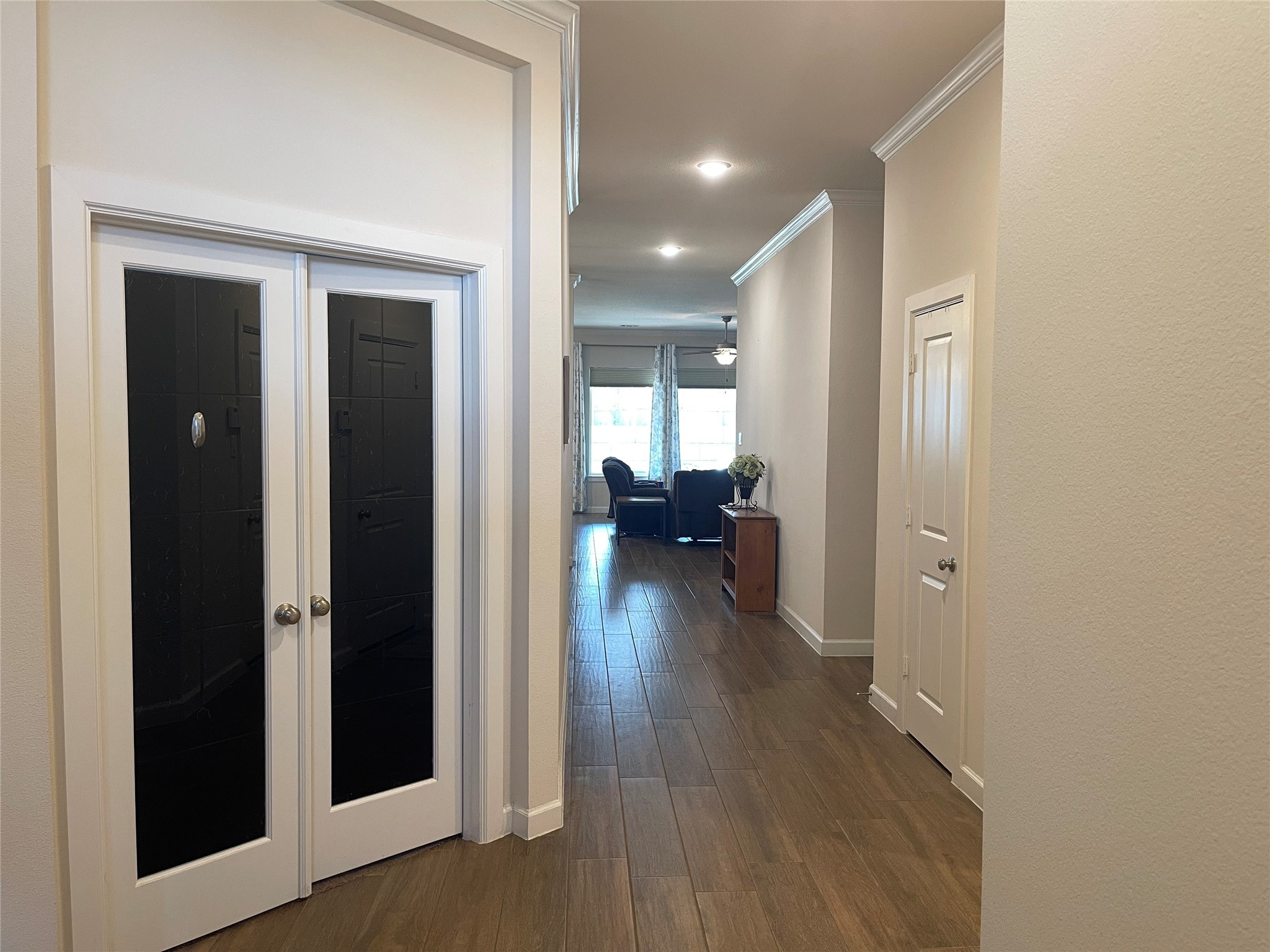 427 Stonebrook Lane Conroe, TX 77304 - Photo 4 of 15 a view of a hallway with living room and dining room