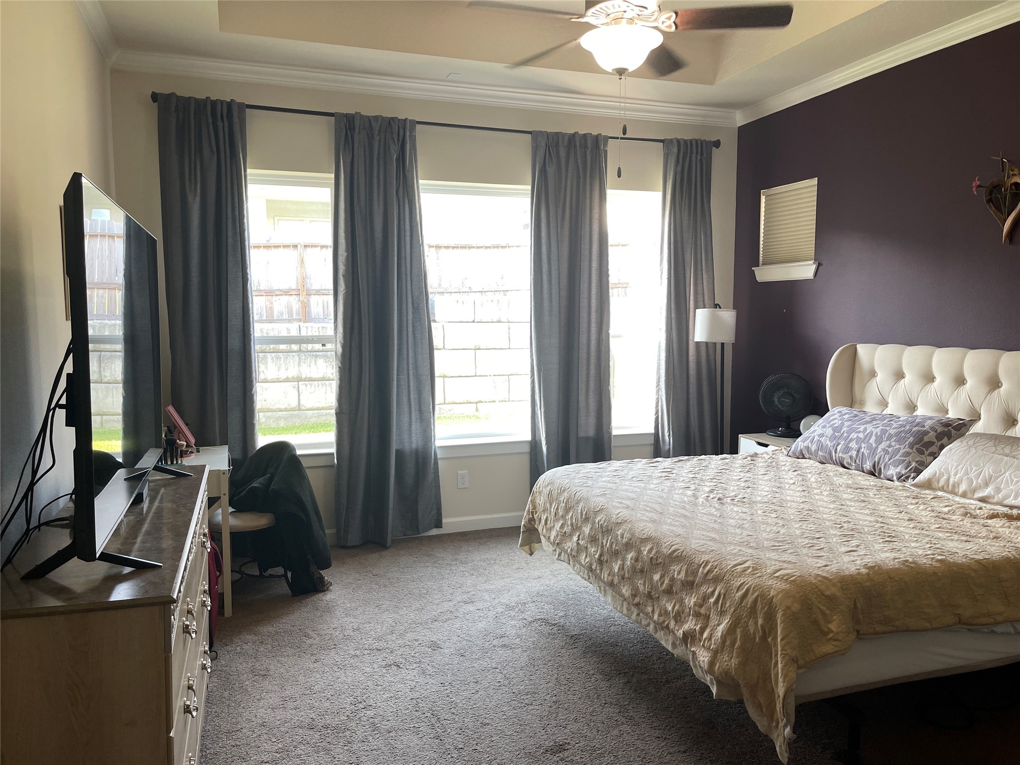 427 Stonebrook Lane Conroe, TX 77304 - Photo 9 of 15 a bedroom with a bed and a chandelier