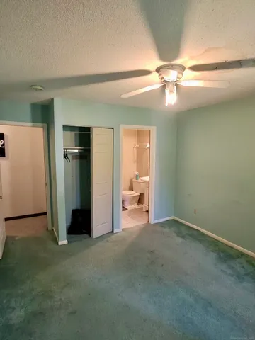 a view of an empty room with a fireplace