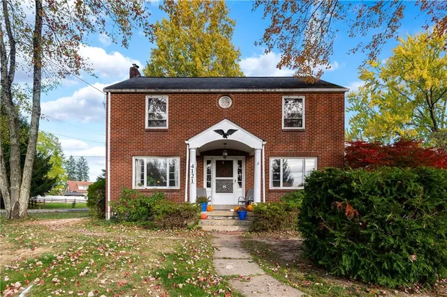 front view of a house with a small yard