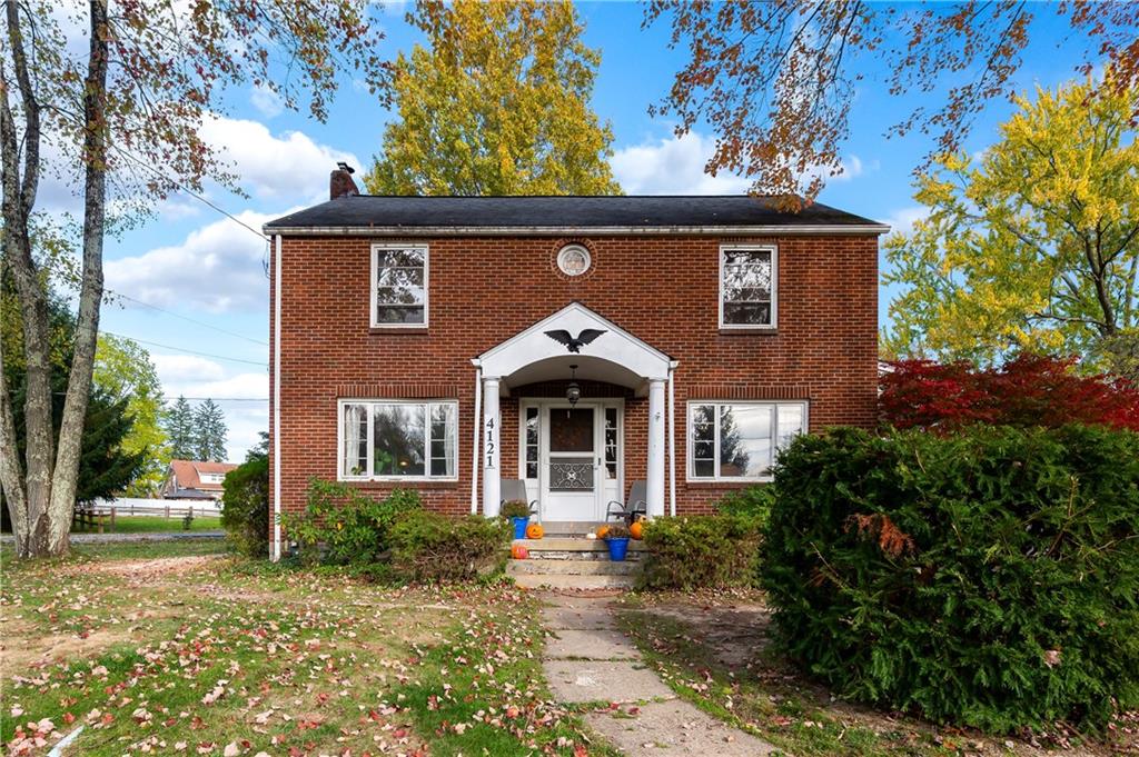 front view of a house with a small yard