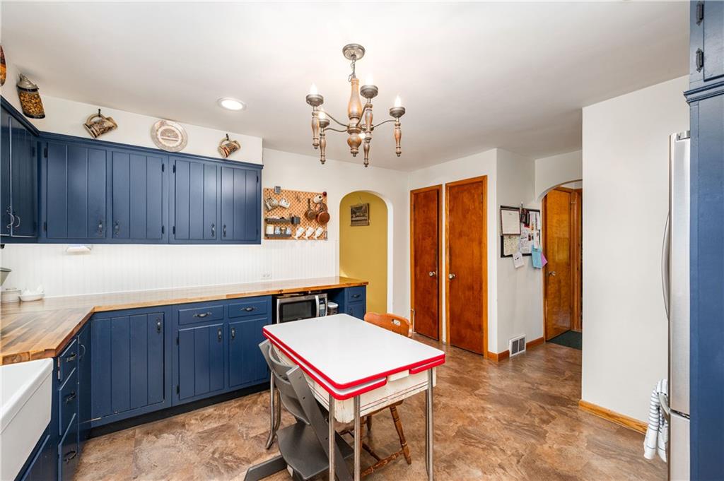 4121 Loring Street Butler, PA 16001 - Photo 11 of 37 a room with pool table a chandelier and a window