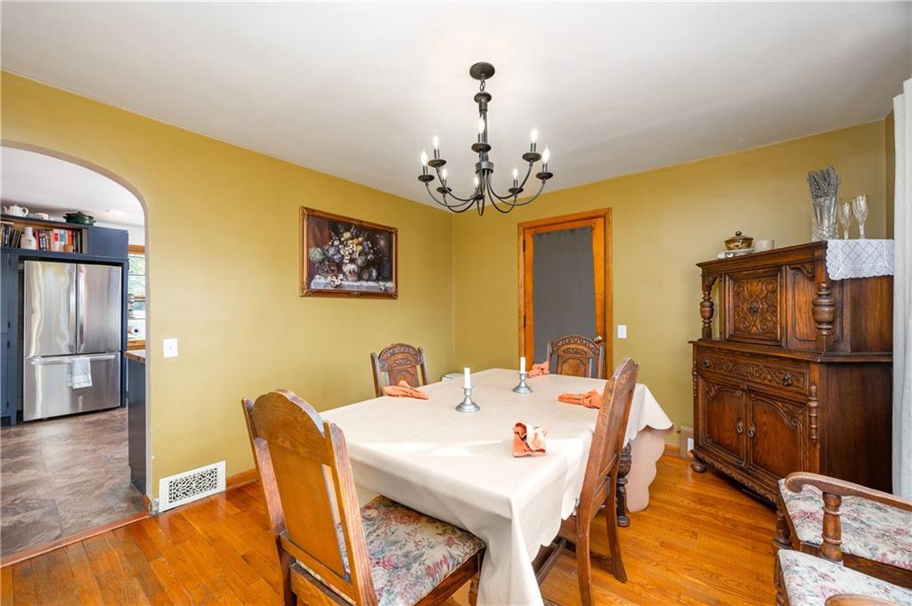 4121 Loring Street Butler, PA 16001 - Photo 12 of 37 a view of a dining room with furniture and wooden floor