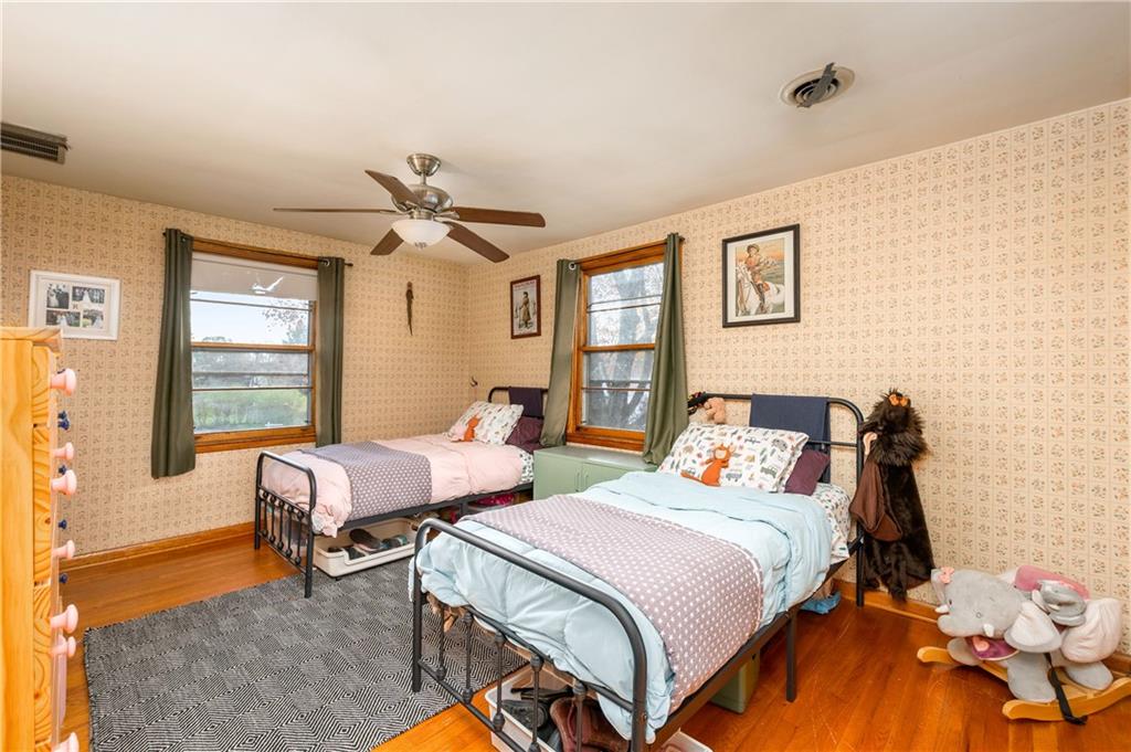 4121 Loring Street Butler, PA 16001 - Photo 17 of 37 a bedroom with a bed and a chandelier