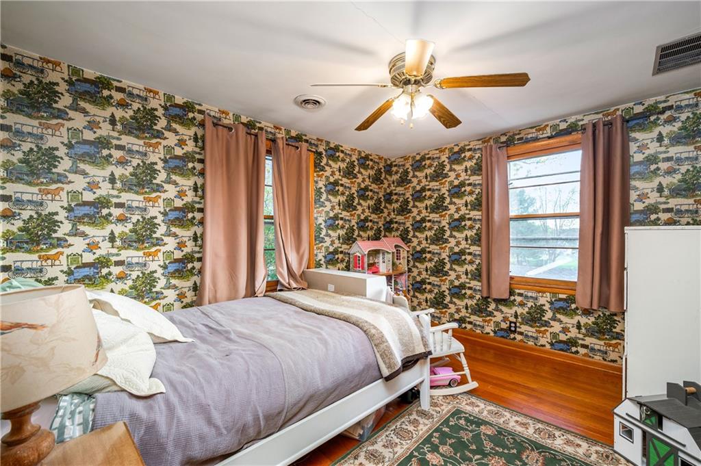 4121 Loring Street Butler, PA 16001 - Photo 19 of 37 a bedroom with a bed and a chandelier