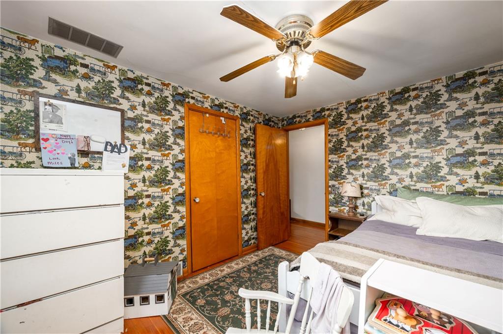 4121 Loring Street Butler, PA 16001 - Photo 20 of 37 a bedroom with a bed and a chandelier