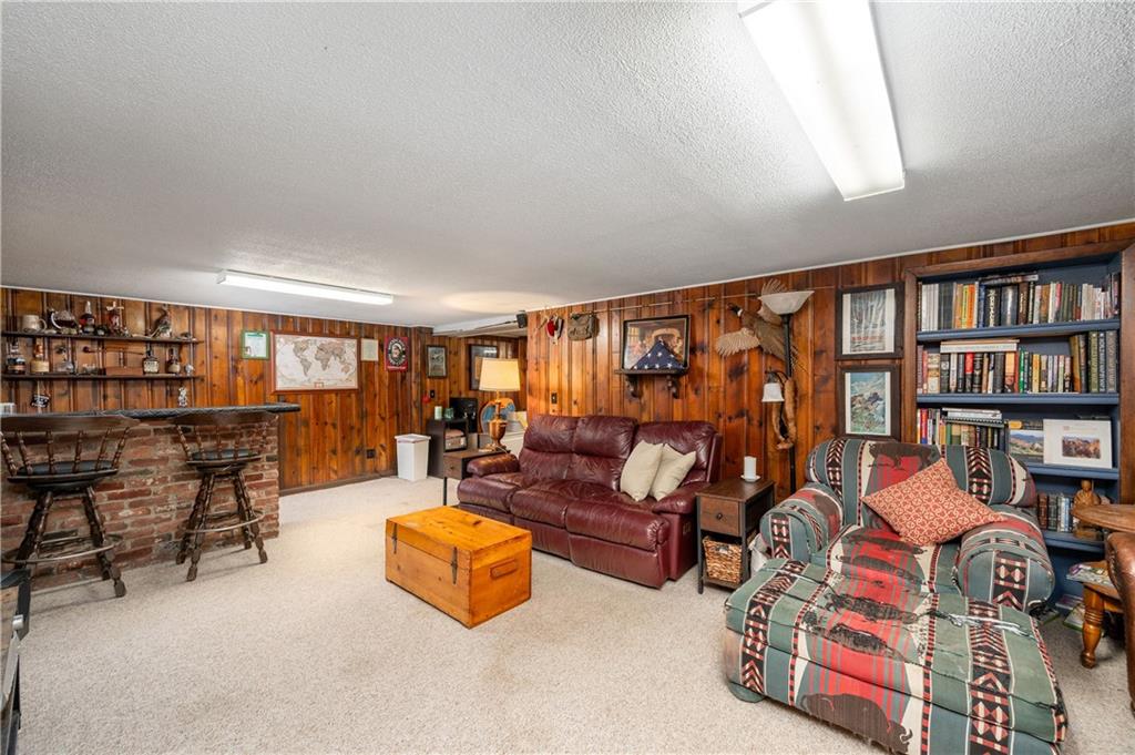4121 Loring Street Butler, PA 16001 - Photo 23 of 37 a living room with furniture and a book shelf