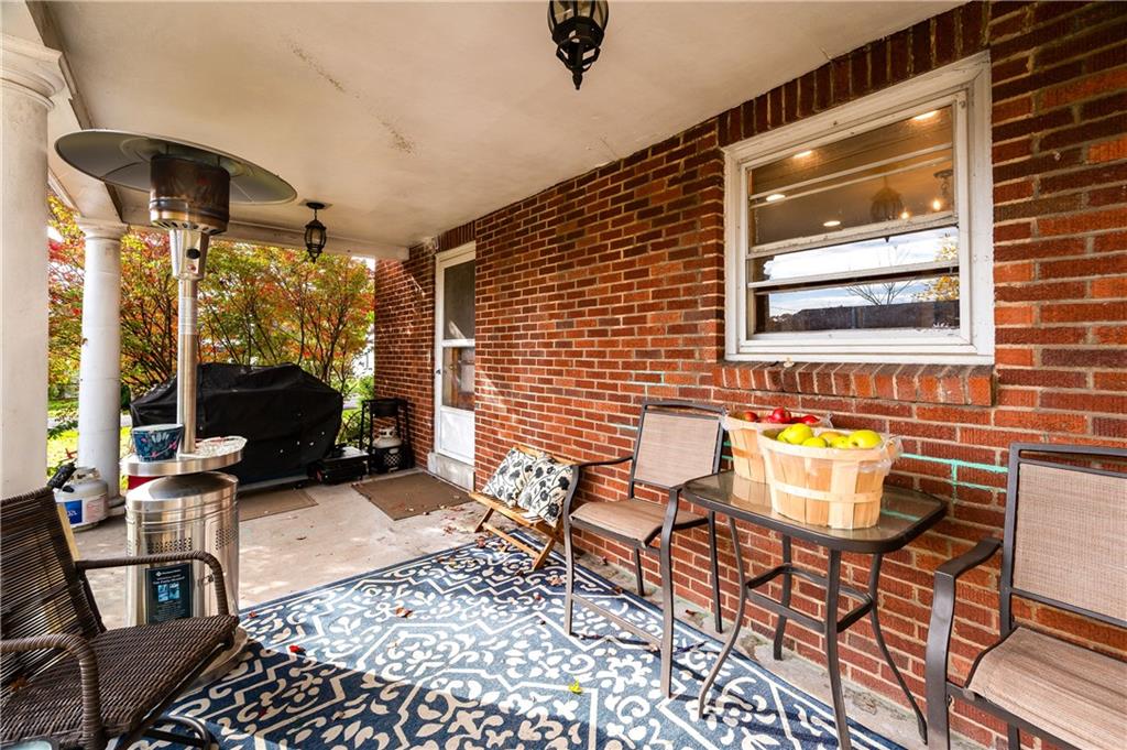 4121 Loring Street Butler, PA 16001 - Photo 25 of 37 a view of a patio with table and chairs and potted plants