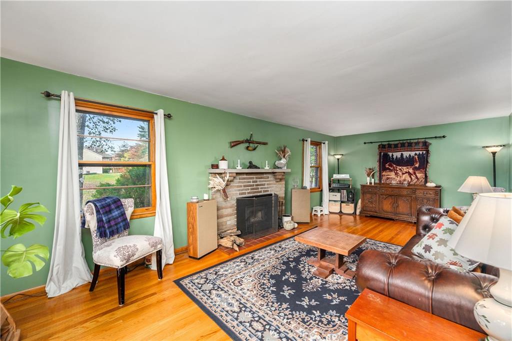 4121 Loring Street Butler, PA 16001 - Photo 5 of 37 a living room with furniture rug and a fireplace