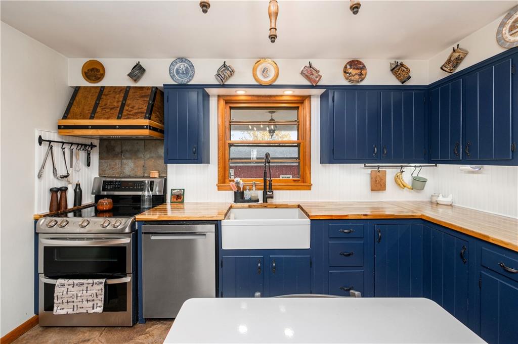 4121 Loring Street Butler, PA 16001 - Photo 9 of 37 a kitchen with stainless steel appliances a stove a sink and a microwave