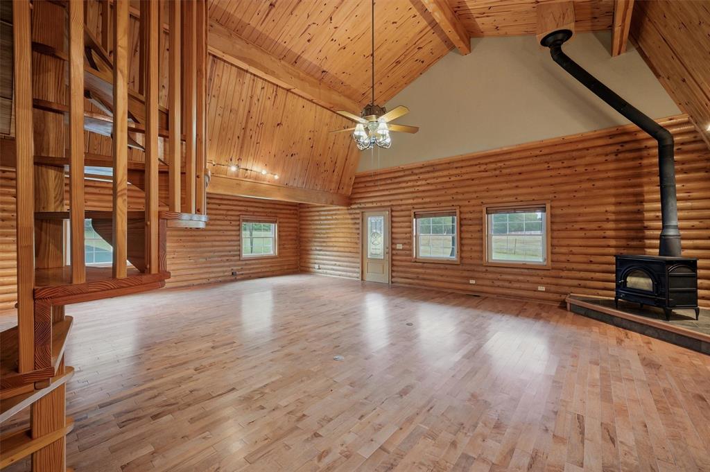 570 Ayres Road Bells, TX 75414 - Photo 12 of 40 a view of a porch with wooden floor and fence