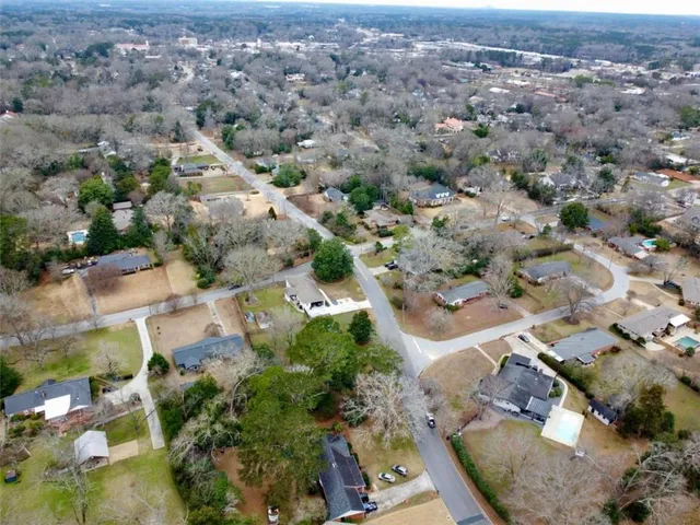an aerial view of residential houses with outdoor space