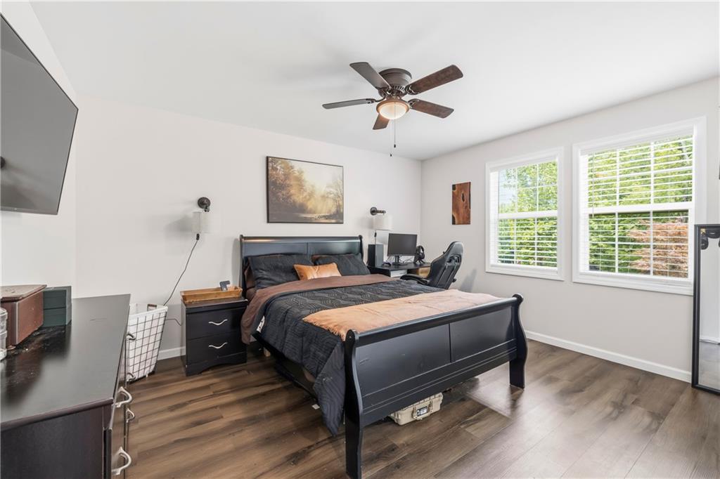 156 Pine Avenue Commerce, GA 30529 - Photo 11 of 35 a bedroom with a bed and a flat screen tv