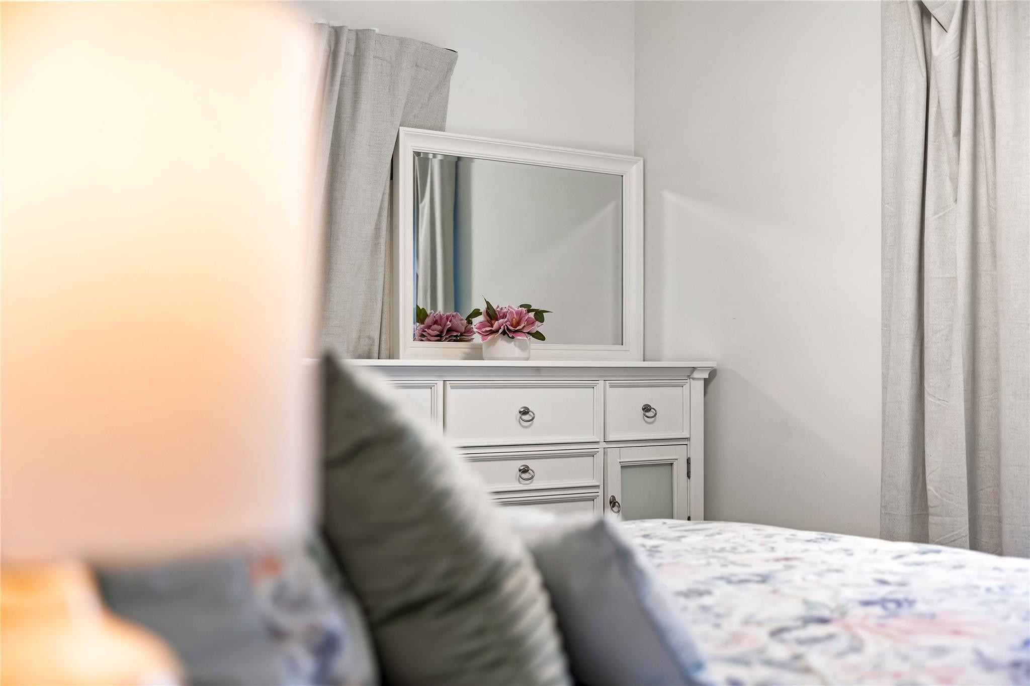 218 Southwest 7th Street Dania Beach, FL 33004 - Photo 25 of 57 a bedroom with a bed and a mirror
