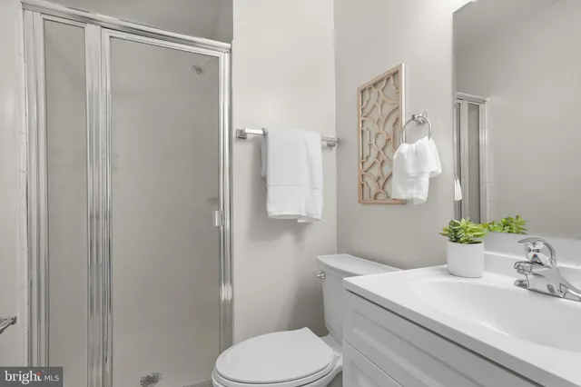 a bedroom with a bed and a lamp