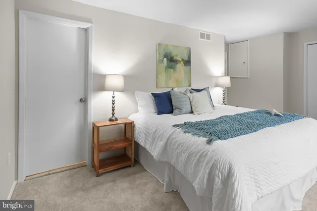 a bathroom with a sink toilet and mirror