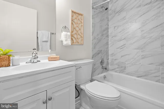 a living room with furniture a rug and a window