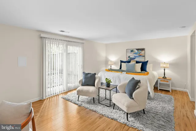 a bedroom with a bed and couch