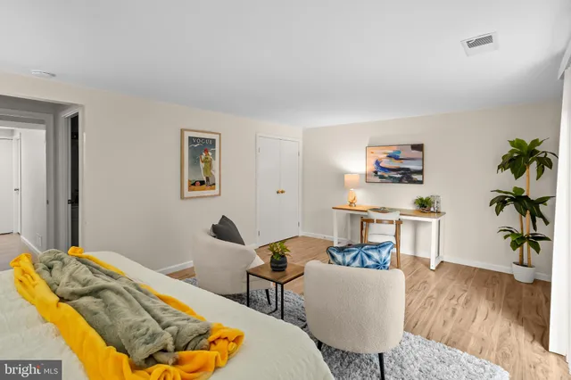 a bathroom with a sink vanity and toilet