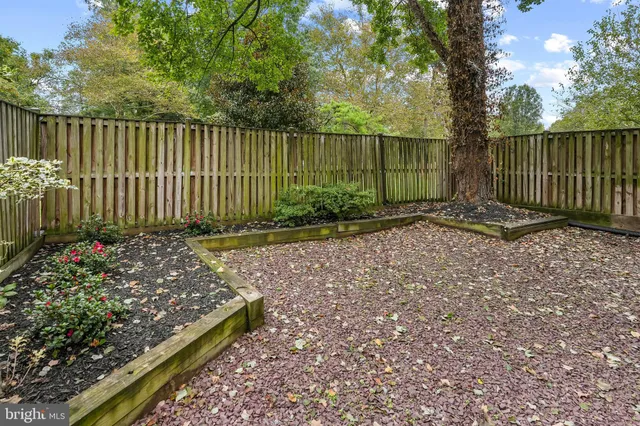 a front view of a house with a fence