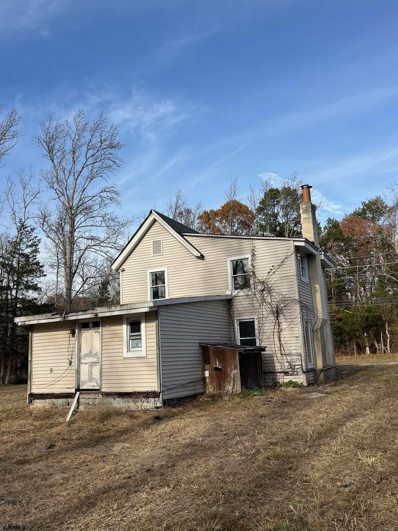 225 Zion Road Egg Harbor Township, NJ 08234 - Photo 2 of 7 a view of a house with a yard
