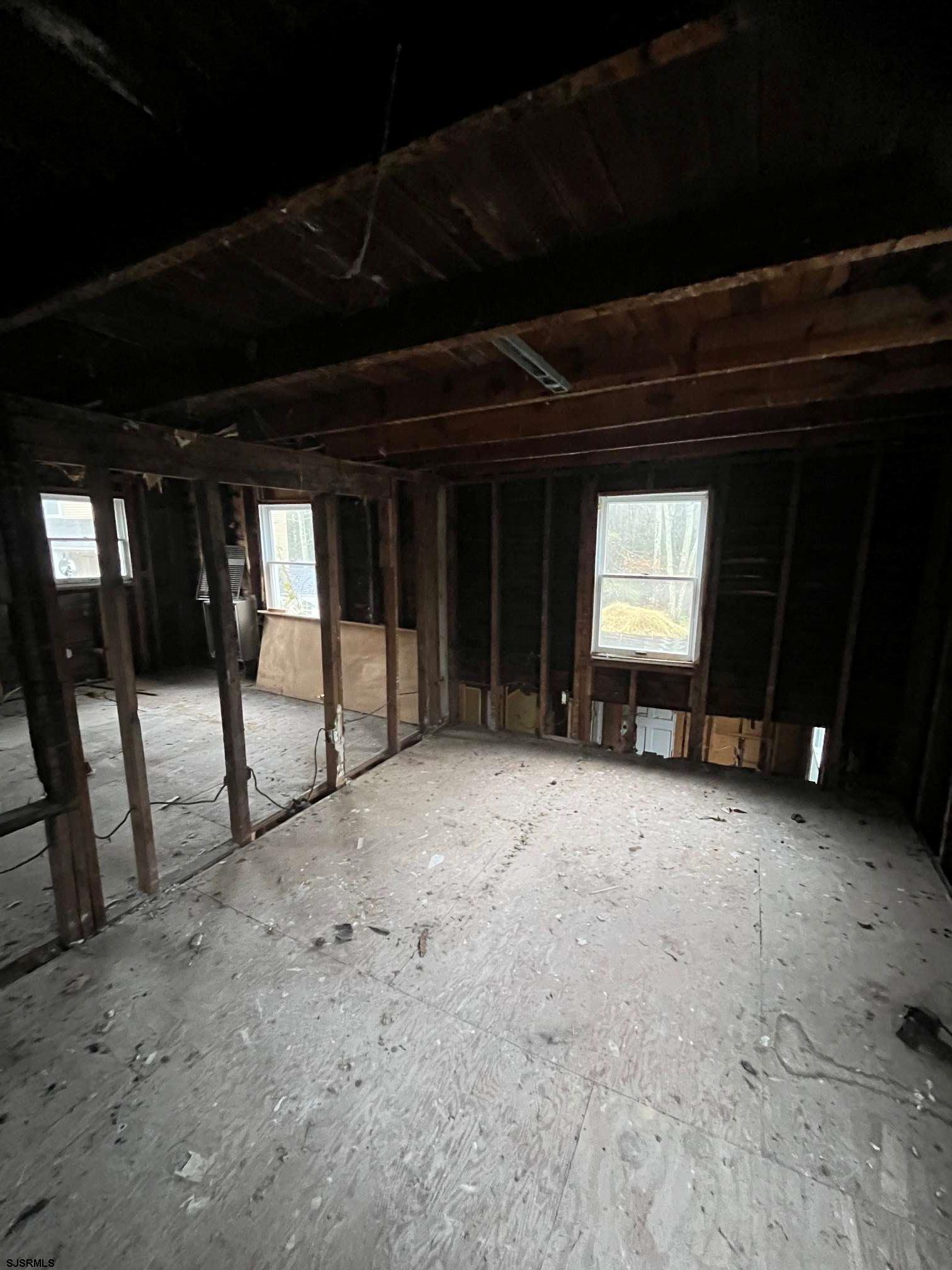 225 Zion Road Egg Harbor Township, NJ 08234 - Photo 6 of 7 a view of an empty room with windows