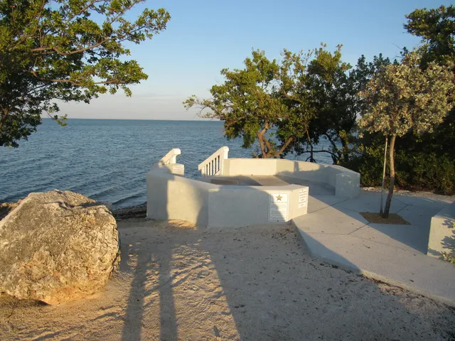 a view of a yard with fountain in front of it