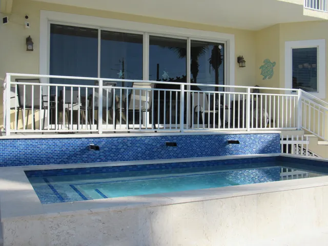 a view of swimming pool with a patio