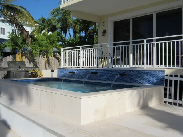 a view of a house with pool and porch