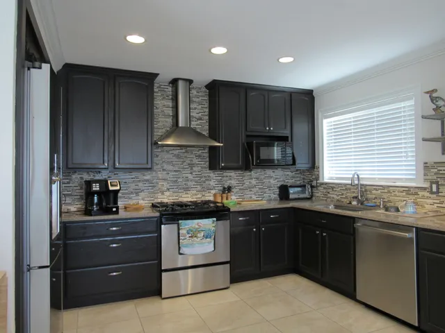 a kitchen with a sink and wooden cabinets