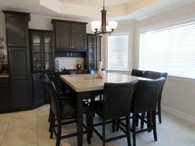 a view of a dining room with furniture and window