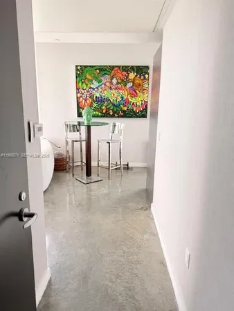 a view of a living room and dining room