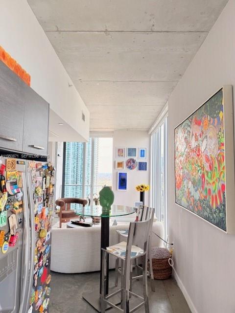 151 Southeast 1st Street, Unit 3010 Miami, FL 33131 - Photo 5 of 22 a dining room with furniture and a window