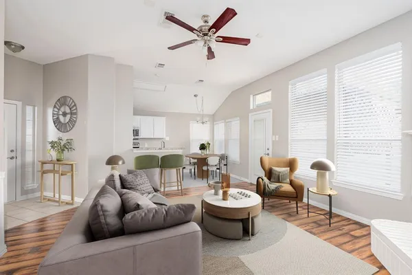 a living room with furniture and a large window