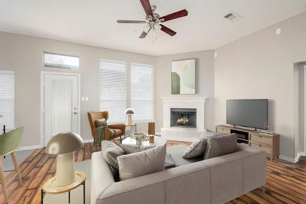 a living room with furniture and a fireplace