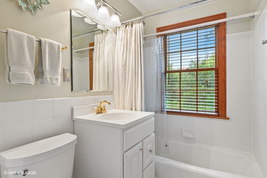323 Wagner Road Northfield, IL 60093 - Photo 11 of 18 a bathroom with a sink a toilet and shower