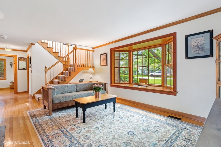 323 Wagner Road Northfield, IL 60093 - Photo 6 of 18 a living room with furniture and a window