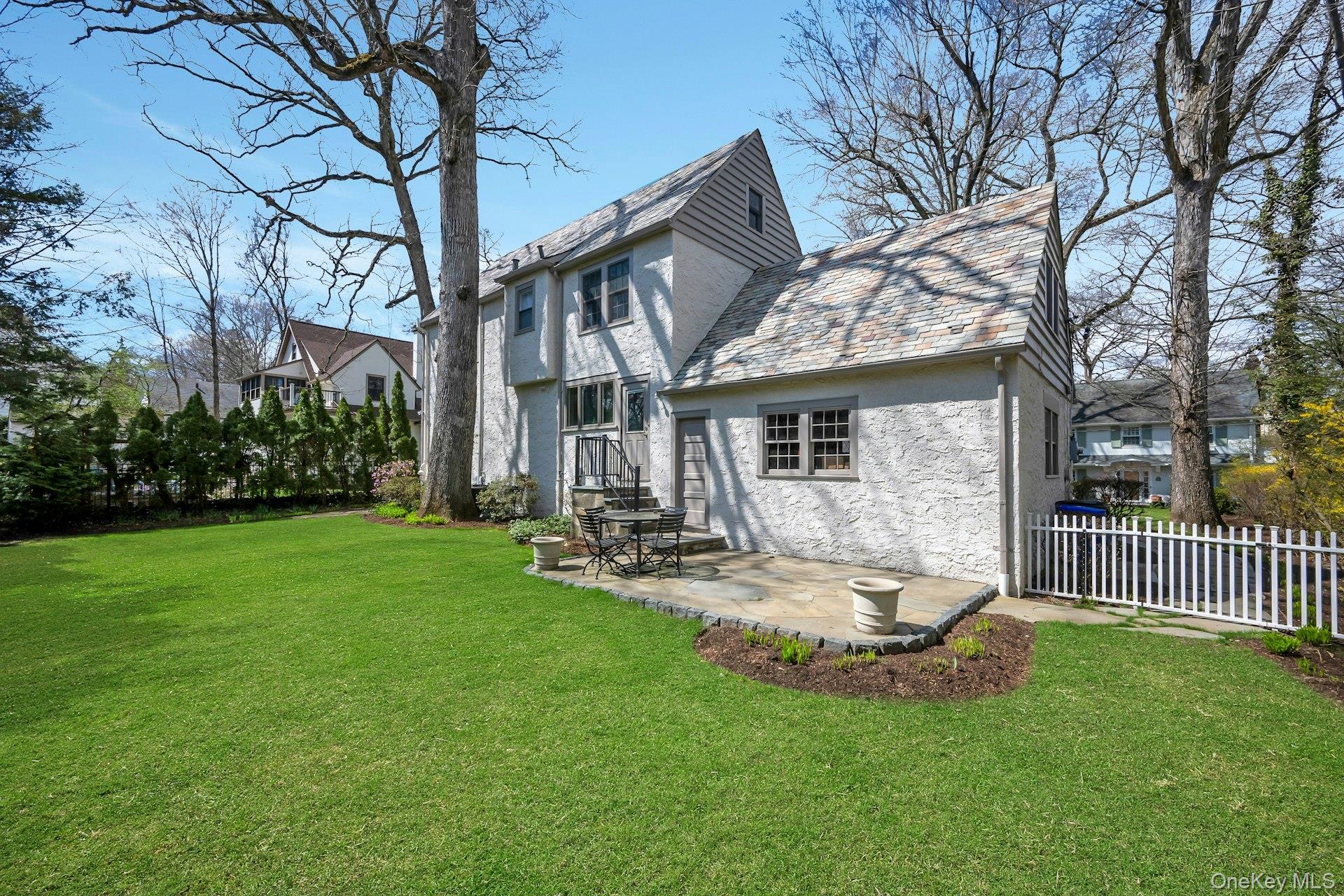12 Barclay Road Scarsdale, NY 10583 - Photo 27 of 32 Back view of home, complete with perennial gardens and in ground sprinklers