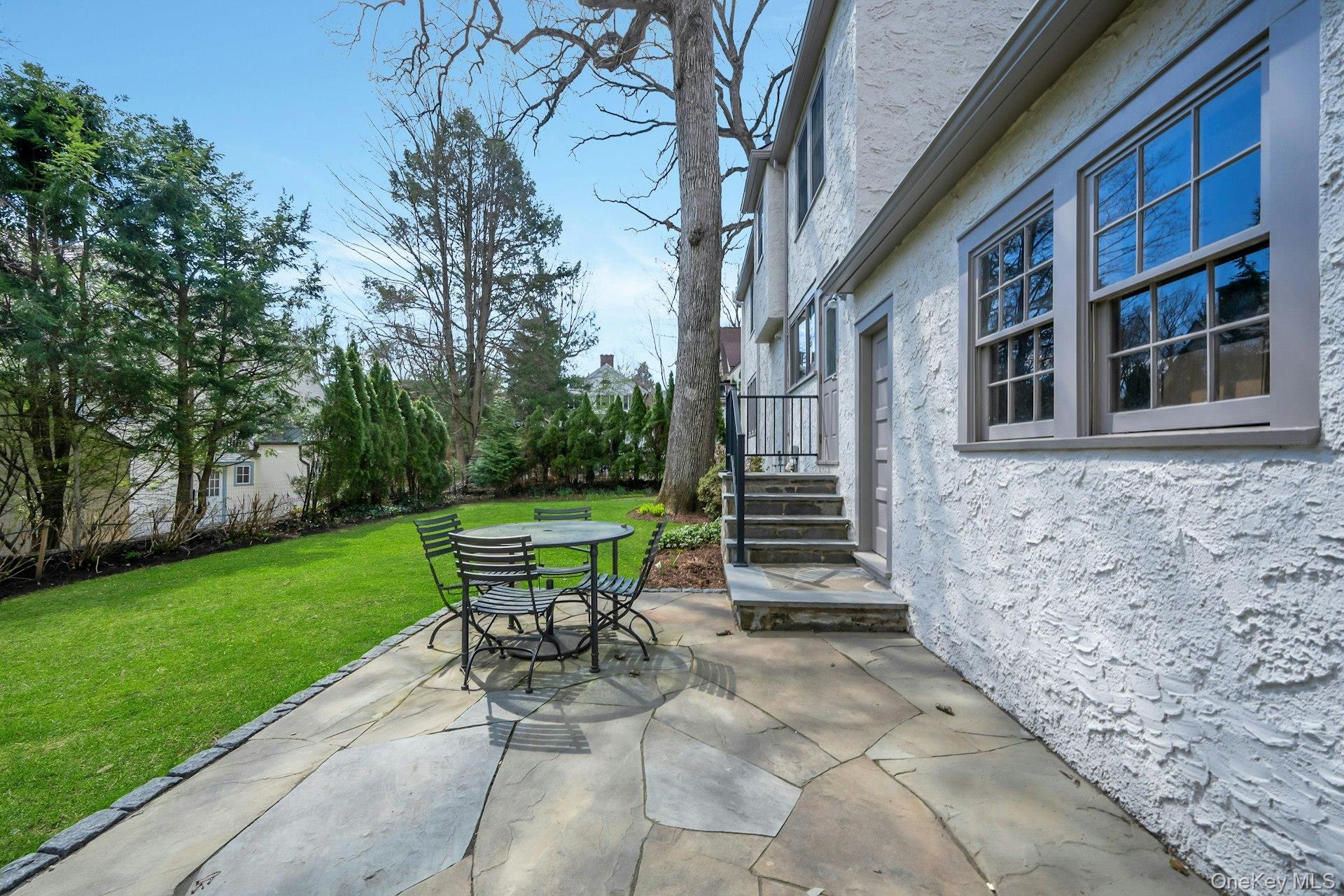 12 Barclay Road Scarsdale, NY 10583 - Photo 28 of 32 New backyard patio with convenient steps up to kitchen entrance