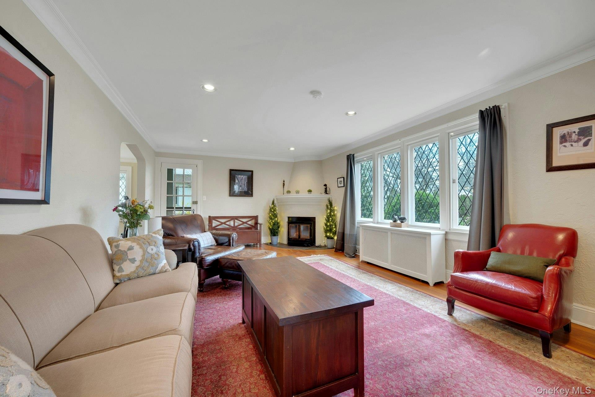12 Barclay Road Scarsdale, NY 10583 - Photo 8 of 32 Living room with fireplace and French door to side covered porch