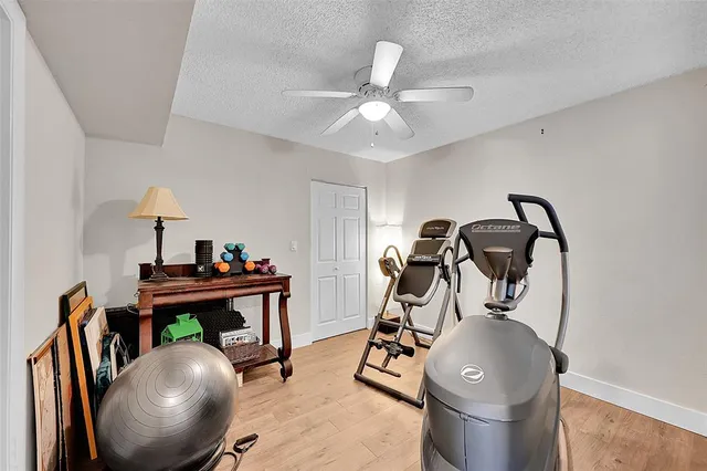 a room with furniture and gym equipment