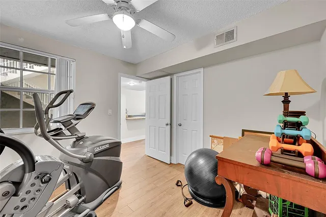 a room with furniture and gym equipment
