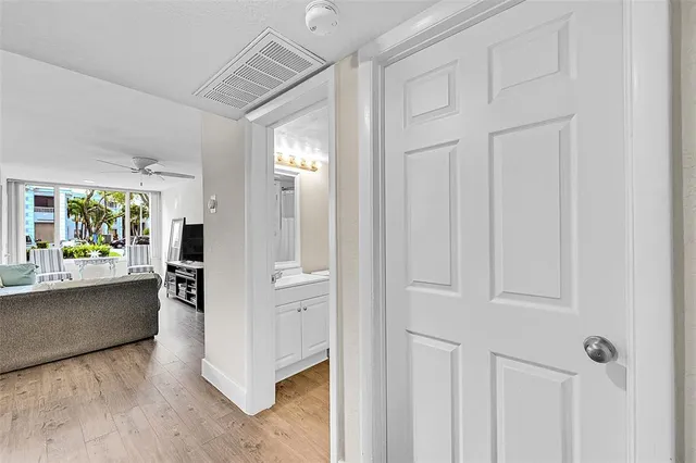 a view of a open kitchen with a refrigerator