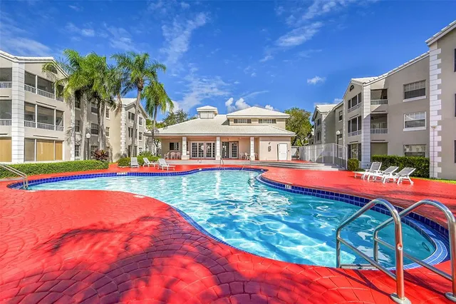 a view of a swimming pool with a patio