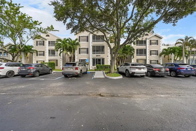 an aerial view of a houses with a lake view