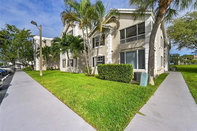 an aerial view of a house with a lake view