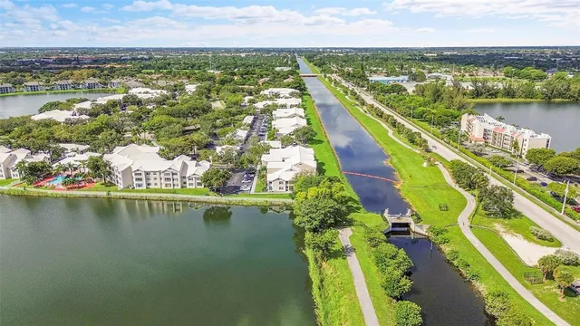 an aerial view of a houses with a lake view