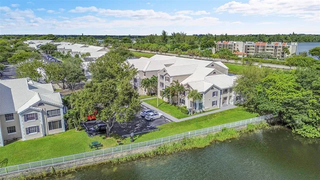 an aerial view of a house with a lake view