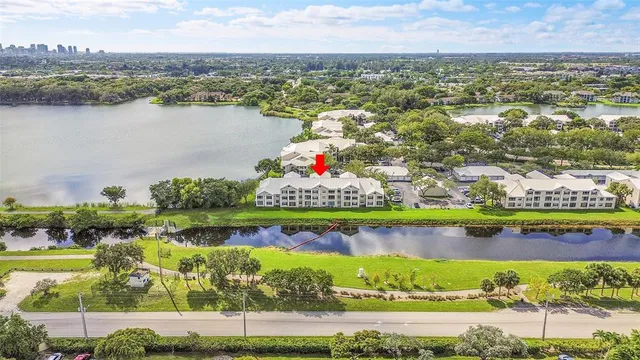 a view of a lake with houses in the back