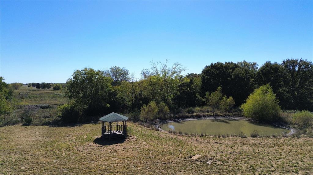 184 County Road Pattonville, TX 75468 - Photo 18 of 20 a swimming pool is sitting in the middle of a lake